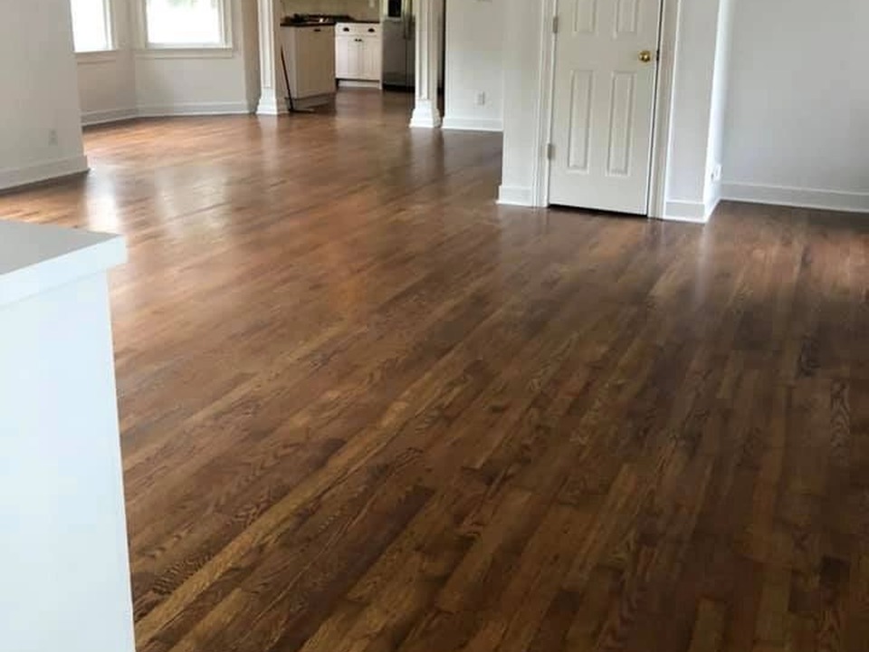 Hardwood flooring installation in open living and dining room